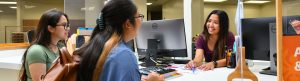 welcome center clerk helping students
