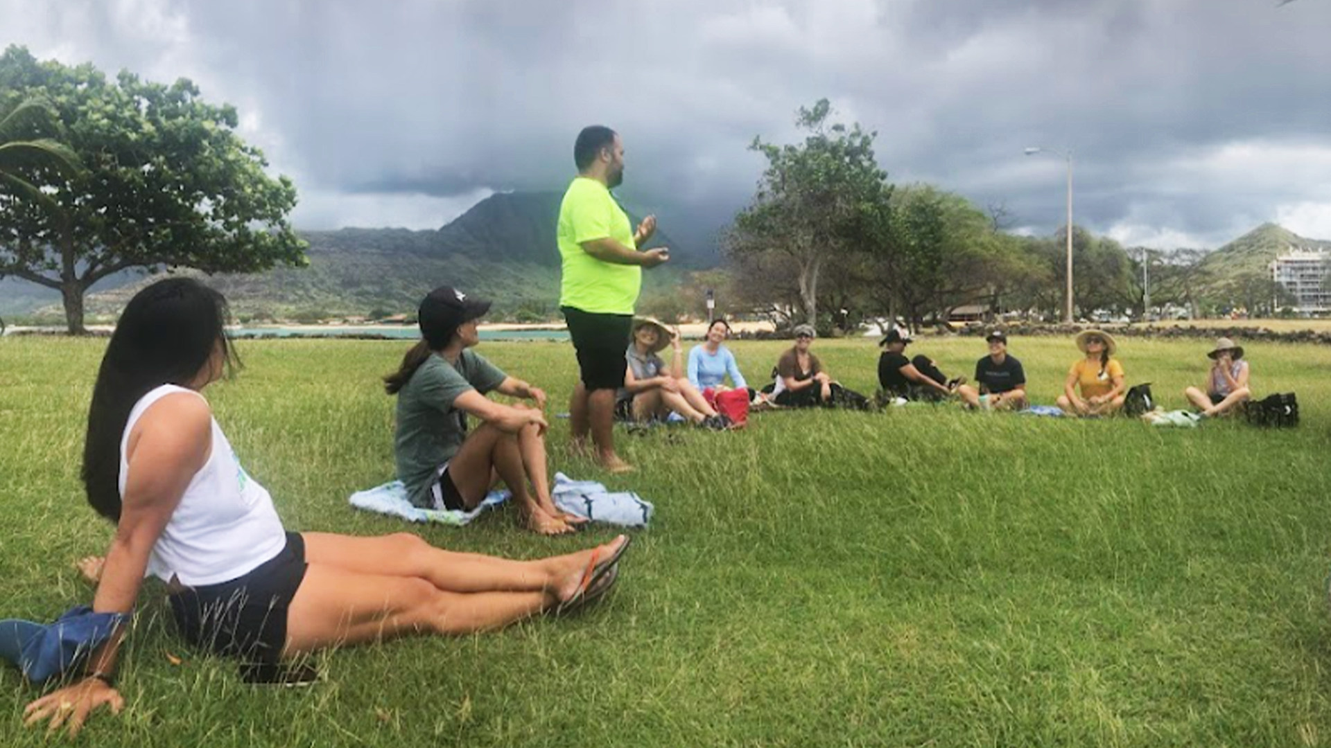 Cohort members having discussion on forest trail